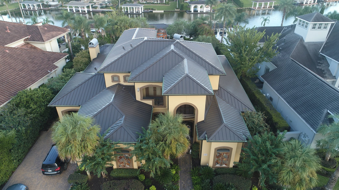 Black standing seam metal roof protecting a Houston home